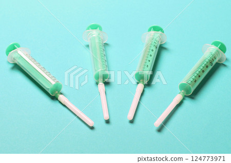 Top view of medical syringes on colorful background. Health care concept with copy space Top view of medical syringes on colorful background. Health care concept with copy space 124773971