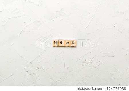 news word written on wood block. news text on table, concept news word written on wood block. news text on table, concept 124773988