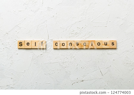 self conscious word written on wood block. self conscious text on table, concept 124774003