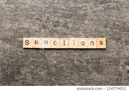 sanction word written on wood block. sanction text on table, concept sanction word written on wood block. sanction text on table, concept 124774052