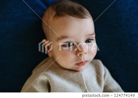 Portrait of baby boy, top view. 124774149
