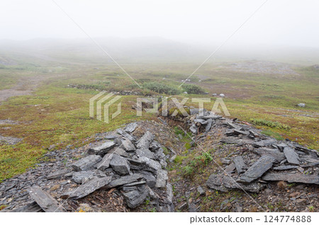 Old abandoned trench in foggy tundra Old abandoned trench in foggy tundra 124774888