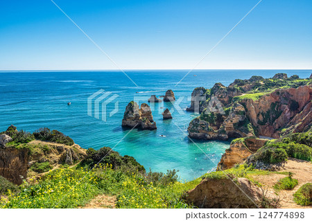 Ponta da Piedade is a unique rock formation with famous grottos in the ocean at Lagos, Algrave, Portugal Ponta da Piedade is a unique rock formation with famous grottos in the ocean at Lagos, Algrave, Portugal 124774898