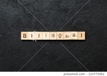 bilingual word written on wood block. bilingual text on table, concept 124775062