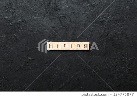hiring word written on wood block. hiring text on table, concept 124775077