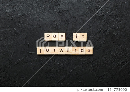 Pay It Forward word written on wood block. Pay It Forward text on cement table for your desing, concept Pay It Forward word written on wood block. Pay It Forward text on cement table for your desing, concept 124775090