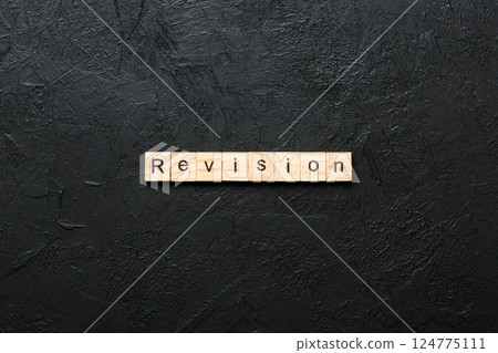 revision word written on wood block. revision text on table, concept revision word written on wood block. revision text on table, concept 124775111