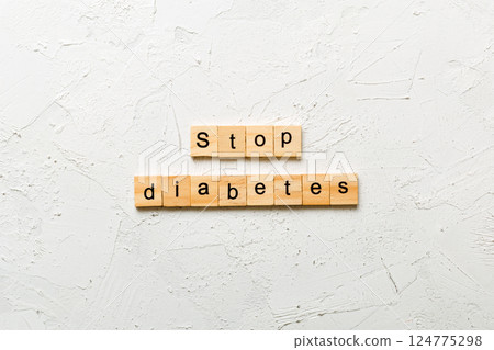 Stop diabetes word written on wood block. Stop diabetes text on cement table for your desing, Top view concept 124775298