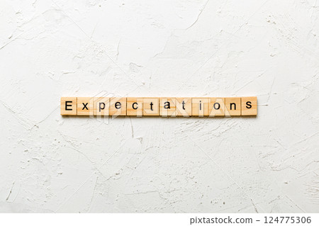 expectation word written on wood block. expectation text on table, concept expectation word written on wood block. expectation text on table, concept 124775306