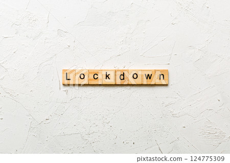lockdown word written on wood block. lockdown text on table, concept 124775309