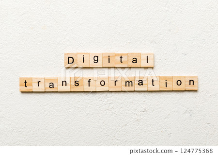 digital transformation word written on wood block. digital transformation text on cement table for your desing, concept 124775368
