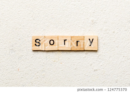 sorry word written on wood block. sorry text on table, concept 124775370