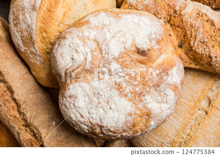 Homemade natural breads. Different kinds of fresh bread as background, top view with copy space 124775384
