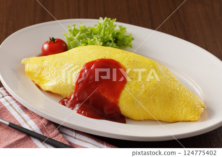 Delicious omelet rice with ketchup Delicious omelet rice with ketchup 124775402