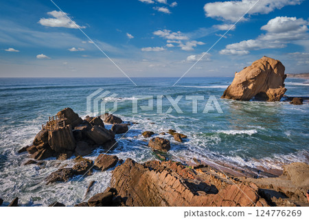 Penedo do Guincho boulder rock at Praia da Santa Cruz, Portugal 124776269