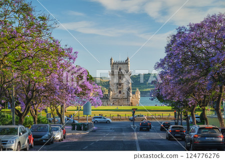 Belem Tower in Lisbon Framed by Blooming Jacaranda Trees and Sailboats on the Tagus River, Portugal 124776276