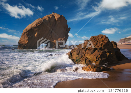 Penedo do Guincho boulder rock at Praia da Santa Cruz, Portugal 124776316