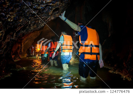 Tourist people walk over water to view Shiva colorful cave, Sa Kaeo 124776476