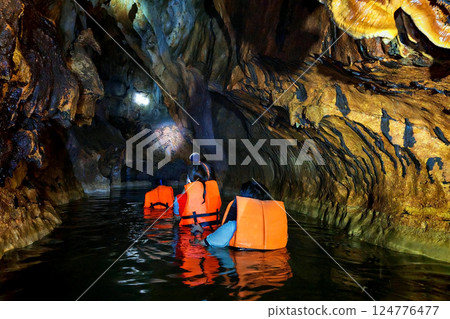 Tourist people over water to view Shiva colorful cave, Sa Kaeo, Thailand Tourist people over water to view Shiva colorful cave, Sa Kaeo, Thailand 124776477