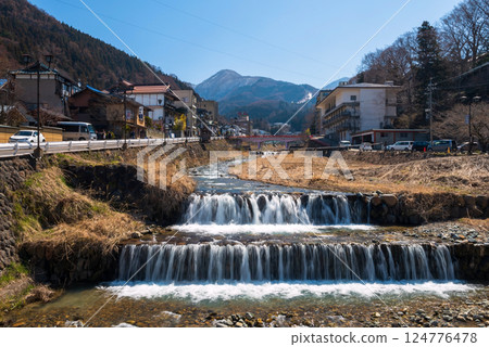 Shibu Onsen hot springs town and Yokoyu river with blue sky, Yamanouchi 124776478