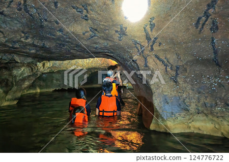 Thai people over water to explore Shiva colorful cave, Sa Kaeo, Thailand 124776722