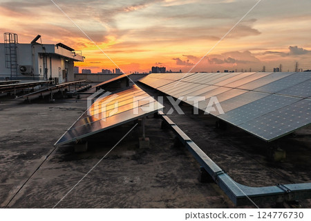 Solar panels on roof top of building with sunset sky at dusk, Bangkok 124776730