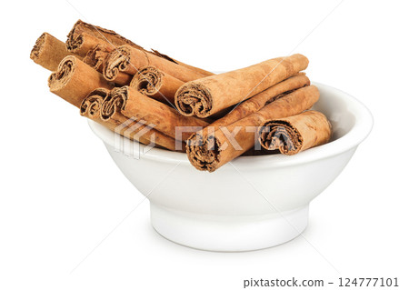 Cinnamon sticks in ceramic bowl isolated on white background with full depth of field 124777101