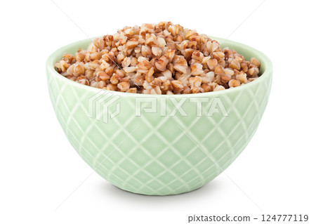 Boiled buckwheat in a ceramic bowl isolated on white background 124777119