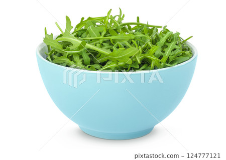 Heap of green fresh rucola or arugula leaf in ceramic bowl isolated on white background 124777121