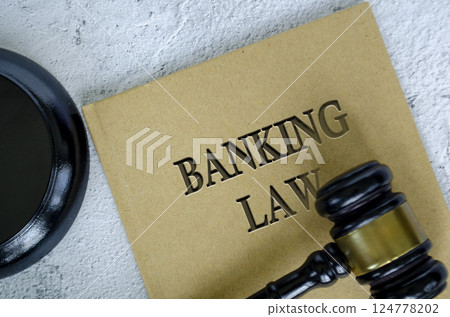 Top view of Banking Law book with gavel on marble background Top view of Banking Law book with gavel on marble background 124778202