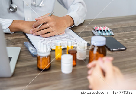 Medication Discussion and Health Strategy. A healthcare professional reviewing a list of medications with a patient to discuss treatment plans. Medication Discussion and Health Strategy. A healthcare professional reviewing a list of medications with a patient to discuss treatment plans. 124778382
