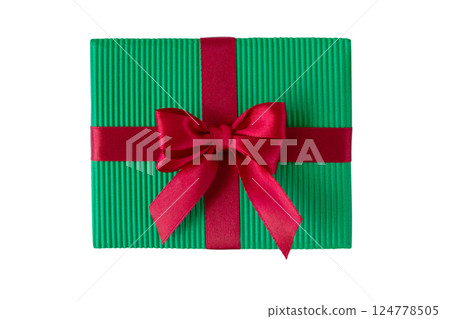 Christmas gift box with satin bow top view isolated on white. Green gift box tied with red silk ribbon. 124778505