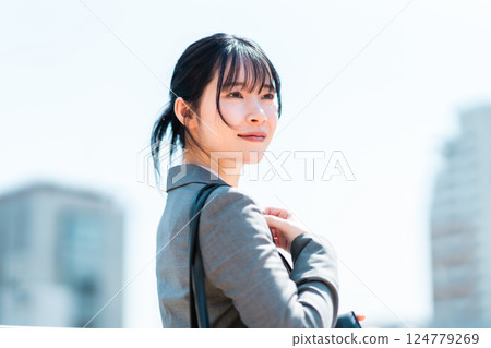 Young business woman running outside 124779269
