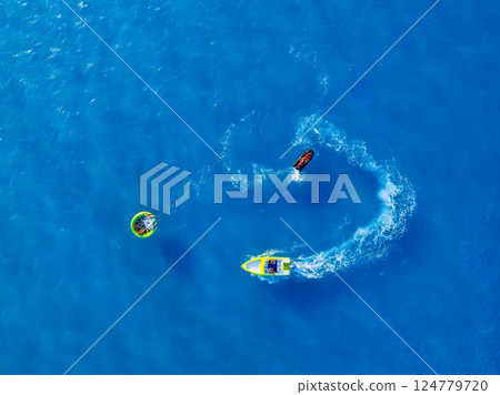 Vacation and leisure. Aerial view on fast boat on blue sea at sunny day. Vacation and leisure. Aerial view on fast boat on blue sea at sunny day. 124779720