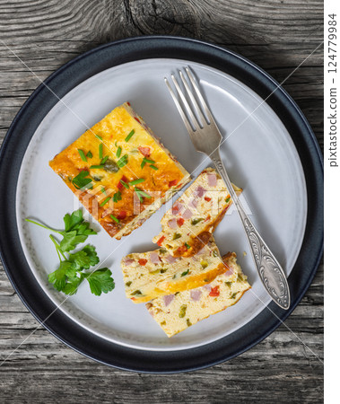 Baked Denver Omelette on a plate with fork 124779984