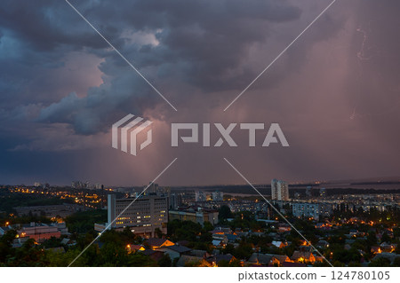 Lightning storm over city at twilight 124780105