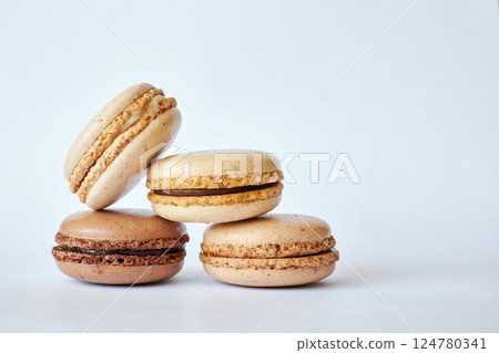 Four brown French Macarons, cakes with coffee and creme brulee flavor 124780341