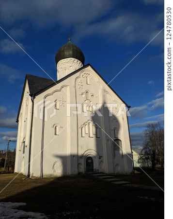 Orthodox Church with a Domed Roof against a Blue Sky 124780530
