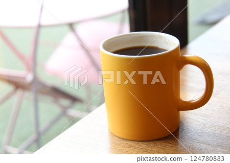 a cup of coffee on a table a cup of coffee on a table 124780883