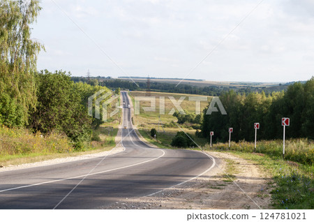 Asphalt road in summer countryside 124781021