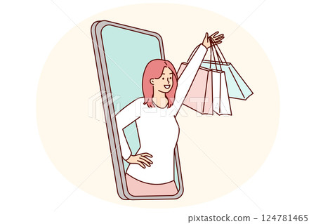 Happy woman peeking out of mobile phone screen raising hand with packages from clothing store 124781465