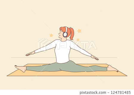 Woman doing pilates while listening to relaxing music on headphones, becoming our god on fitness mat Woman doing pilates while listening to relaxing music on headphones, becoming our god on fitness mat 124781485
