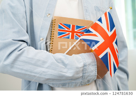 Learn English language, Asian teenage student hold book with flag in course at school. 124781630