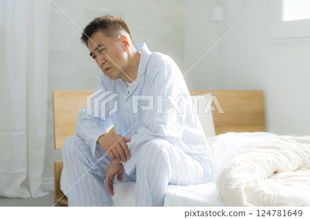 Senior man in bed, back pain, joint pain Senior man in bed, back pain, joint pain 124781649