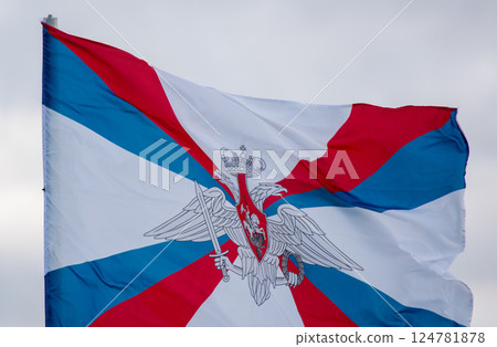 The flag of the Ministry of Defense of the Russian Federation is flying in the wind against a cloudy sky. 124781878