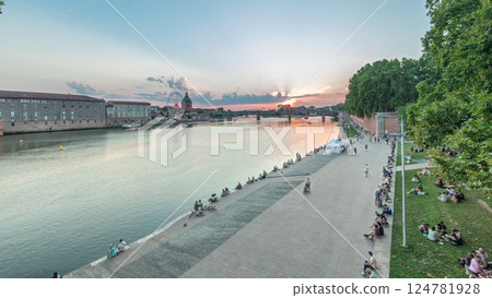 Aerial view of Port de la Daurade park along the Garonne River day to night timelapse in Toulouse, France. 124781928