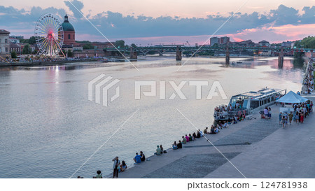 Aerial view of Port de la Daurade park along the Garonne River day to night timelapse in Toulouse, France. 124781938