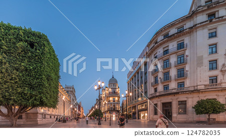 Illuminated Adriatica building on Avenida de la Constitucion at night, Seville, Spain 124782035