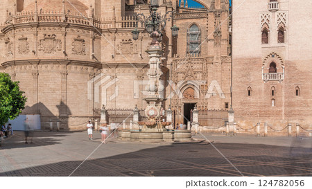 Seville Cathedral and Fuente Farola Fountain on Plaza de Virgen de los Reyes timelapse 124782056