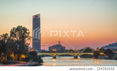 Seville skyline day to night timelapse with Torre Sevilla and Triana Bridge 124782058